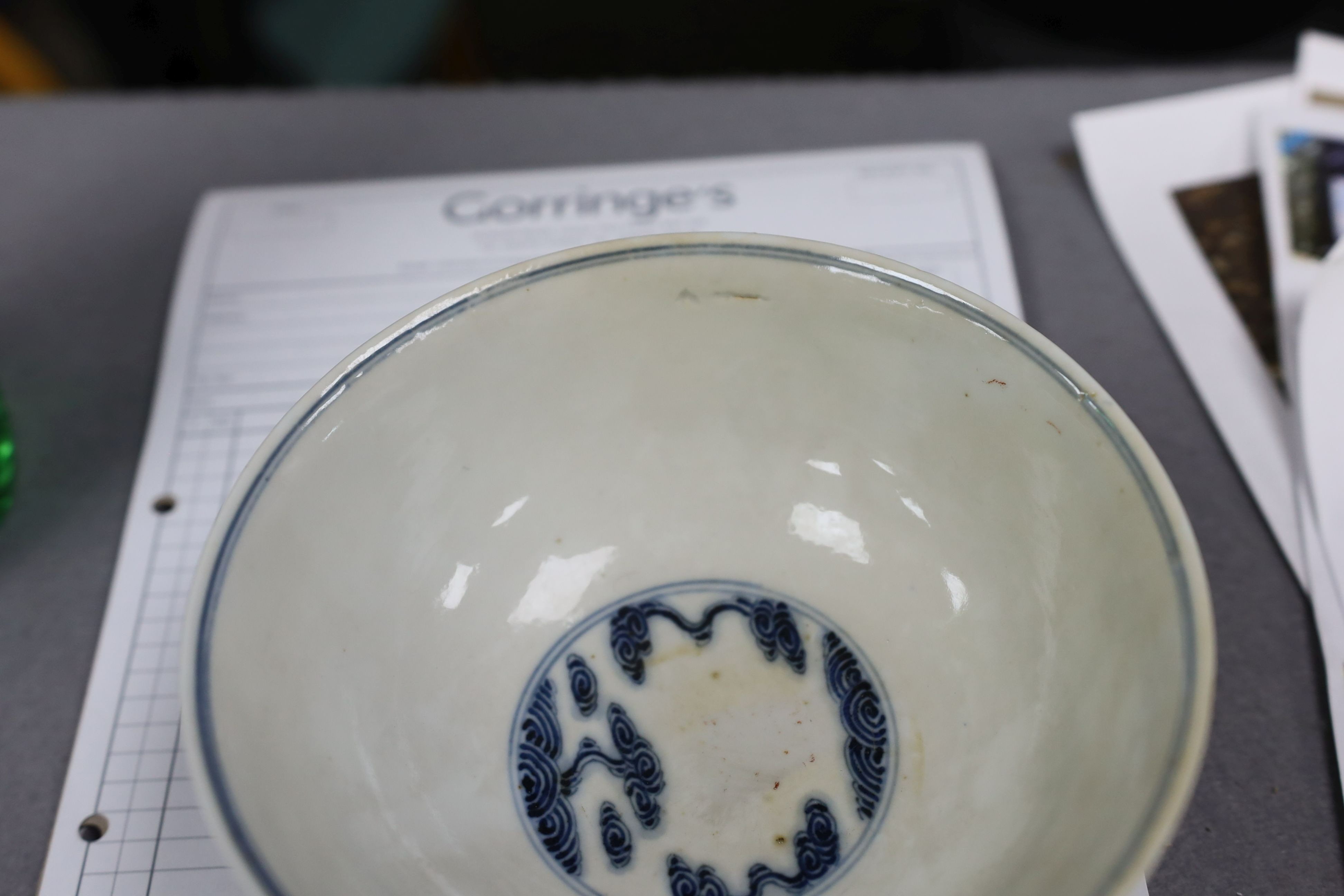 A pair of Chinese iron red and underglaze blue ‘five bat’ bowls, Guangxu mark and probably of the period (1875-1908), 16.5cm diameter